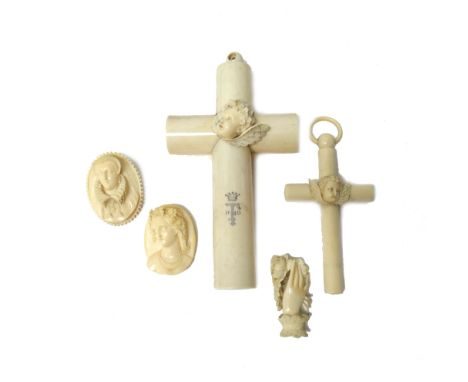 A group of 19th century ivory jewellery and works of art, comprising; one large and one smaller crucifix, each with a central