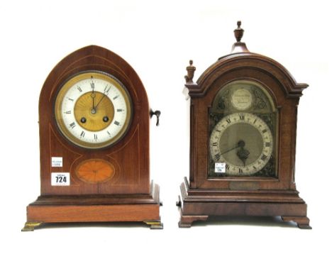 An Edwardian mahogany and inlaid mantel clock of navette shape, with enamelled and engine turned dial and a French two train 