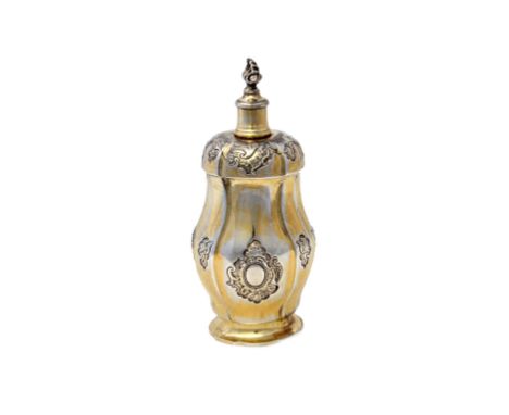 A Danish Sterling silver gilt bottle, having a screw top with a flaming finial, the body decorated with rococo cartouches and