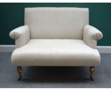 OKA; A 20th century cream upholstered two seat sofa, with roll over arms on turned supports, 110cm wide x 86cm high. 