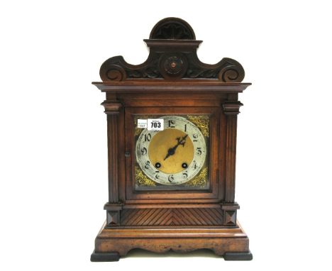 A walnut cased mantel clock, late 19th century, with a two train Westminster type movement, 44.5cm high, (key and pendulum).