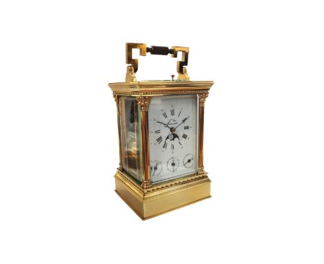 A L'Epee brass repeating carriage clock, with visible escapement and push button repeat over a white enamel dial, scroll pain