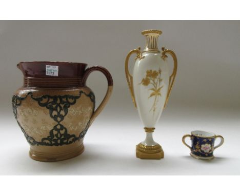 A Royal Worcester two handled porcelain vase, late 19th century, gilt foliate decorated against an ivory ground (21.5cm high)