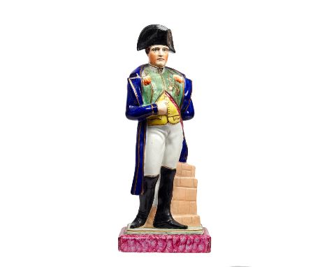 A Staffordshire portrait figure of Louis Napoleon, 19th century, polychrome decorated, modelled standing in typical pose atop