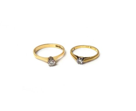 A Swedish gold and diamond set single stone ring, claw set with a circular cut diamond, detailed 18 K, ring size N and a half