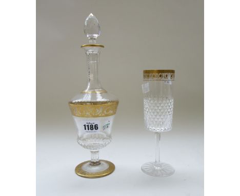 A St Louis style crystal part suite of stemware, hobnail cut with gilt foliate decoration, comprising; a decanter and stopper