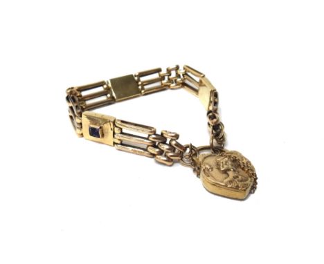 A gold and amethyst set bar and oval link gate bracelet, having three rectangular amethyst set panels at intervals, on a gold