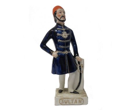 A Staffordshire portrait figure of Abdul Mejid, Sultan of Turkey, 19th century, polychrome painted atop a gilt titled rectang