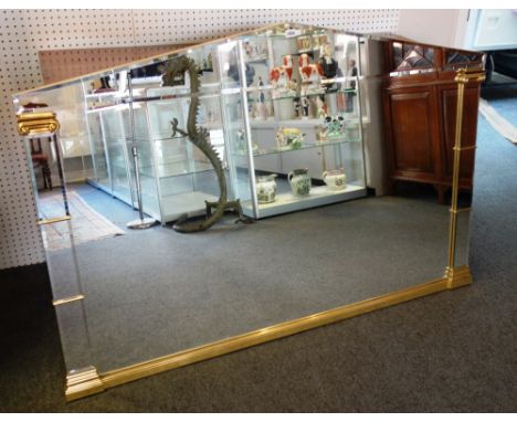 A A Hollywood Regency style architectural arch top parcel gilt metal bevelled glass wall mirror, 163cm wide x 110cm high.