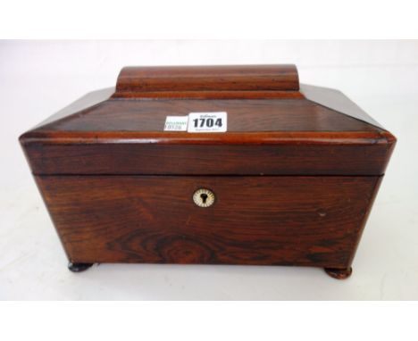 A Regency rosewood sarcophagus tea caddy, with twin lidded interior, 30cm wide x 20cm high.