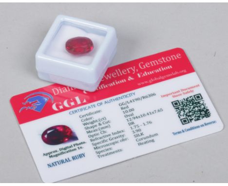 A cased ruby, oval cut, with heat treatment, 10ct, with certificate. 