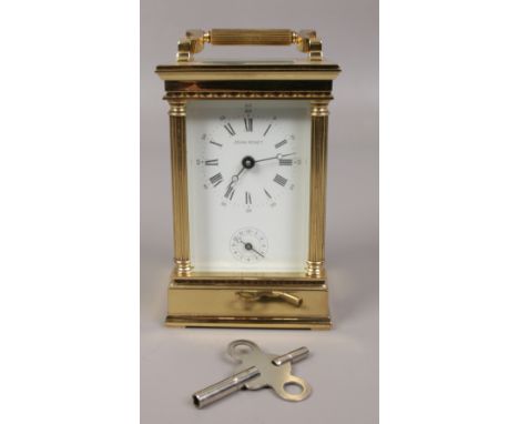 A brass Jean Renet carriage alarm clock with key, 