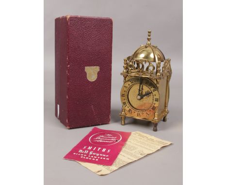 A boxed Smiths brass electric lantern clock. 