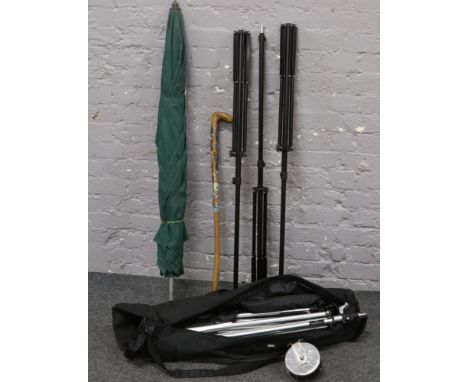 A group lot of umbrellas, tripods, walking stick, Alvey fishing reel etc. 