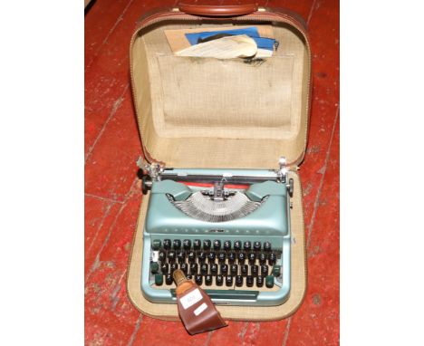 A vintage Imperial 'Good Companion 4' typewriter in original case. 