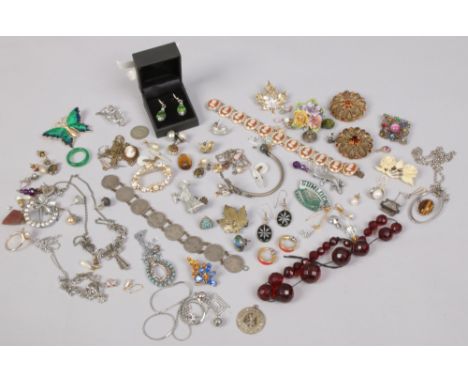 A box of mixed vintage costume jewellery including coin bracelet, cameos, filigree pieces and a cherry amber coloured faceted