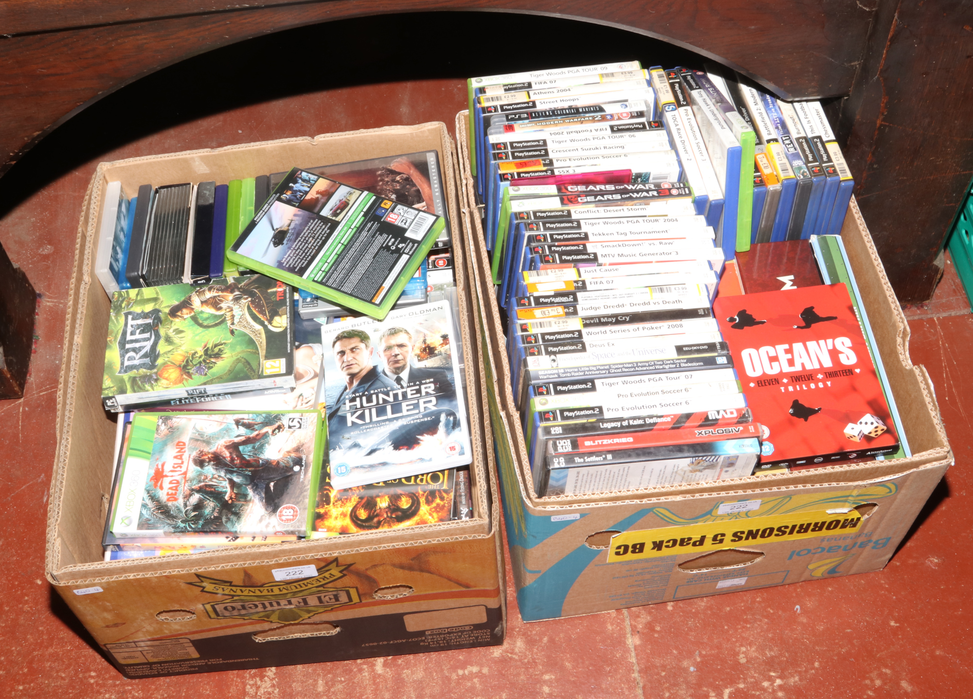 Two boxes of DVDs and games to include Playstation 2, Playstation 3