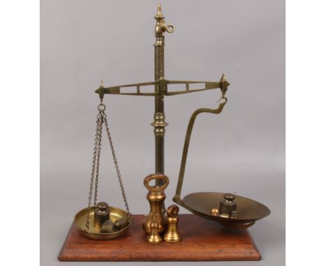A set of vintage brass and mahogany balance scales and weights by Bartlett &amp; Sons Limited Bristol. 