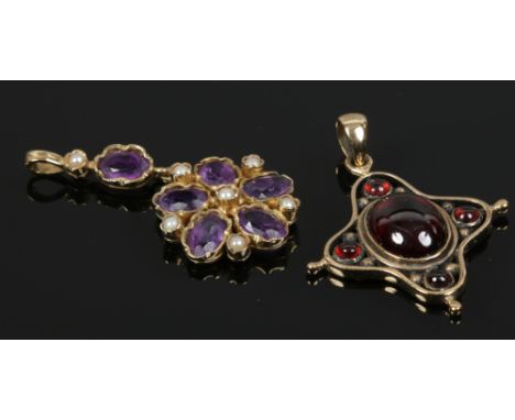 A 9ct gold and cabochon garnet cruciform pendant and a 9ct gold amethyst and seed pearl floriform pendant. 