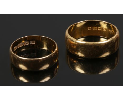 A pair of 22ct gold wedding bands. 14.6 grams, size R and Q. 