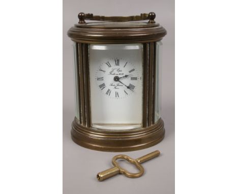 A miniature French L'epee brass carriage clock with key, 8cm. 