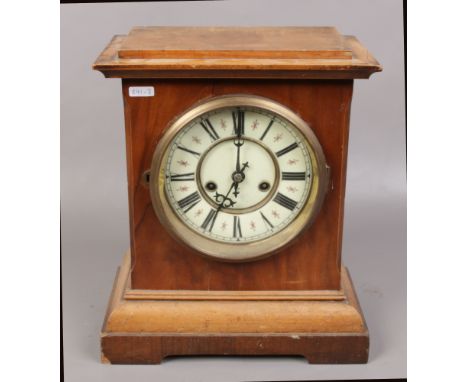 A mahogany H.A.C 14 day mantle clock with enamel dial, Roman numeral markers, chiming on a coiled gong. 