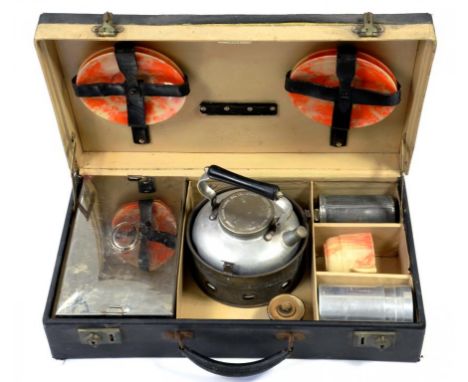 A SIRRAM PICNIC CASE, WITH METAL AND MARBLED PLASTIC CONTENTS,  INCLUDING KETTLE, CANISTERS, BOX AND A EIGHT CUP AND SAUCERS,