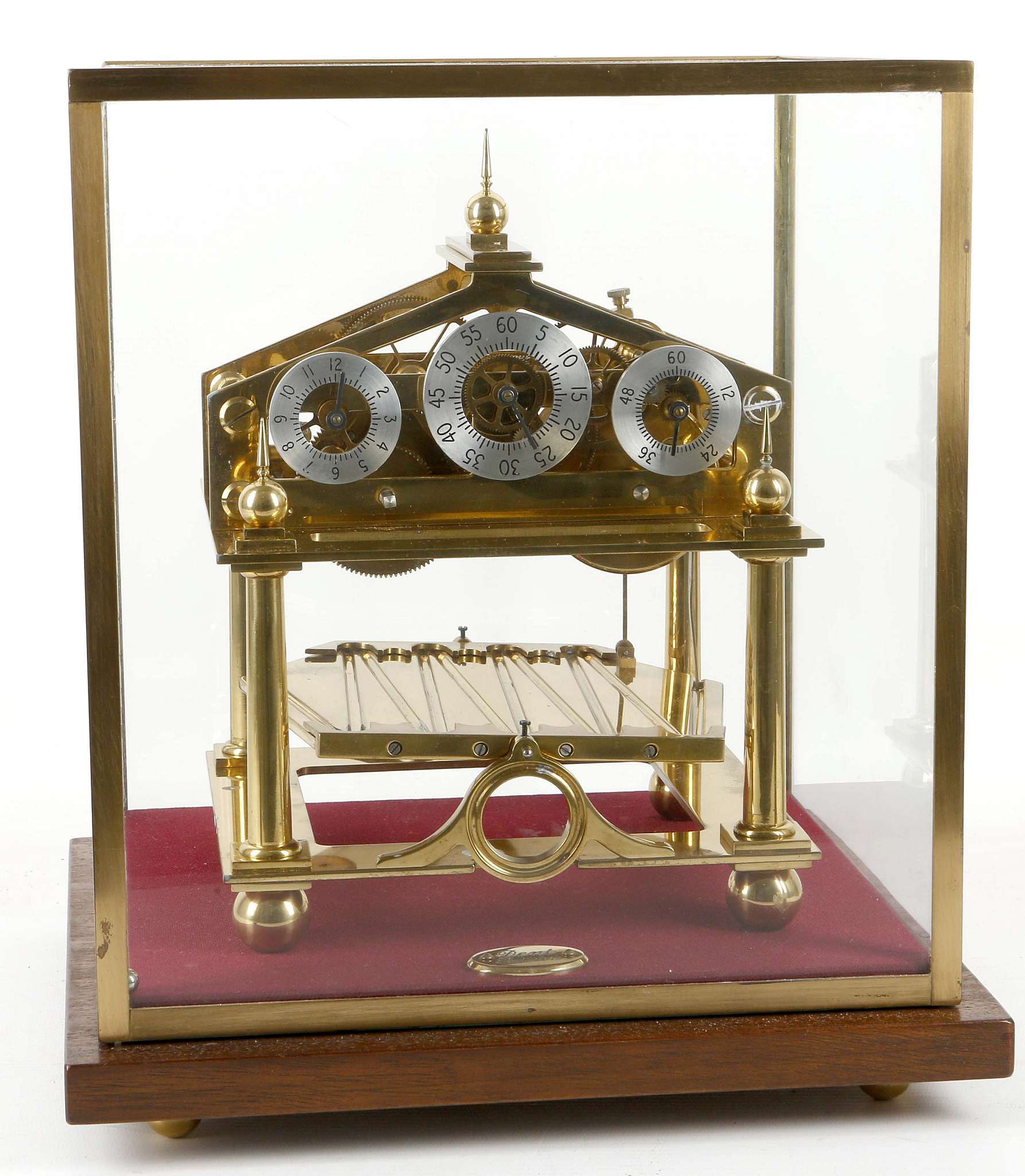 A gilt brass Congreve rolling ball clock by Dent c.1970, mounted on a