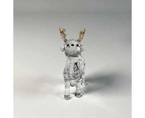 Adorable reindeer figure featuring light gold colored horns, beautifully crafted from clear crystal. Swarovski swan mark on t