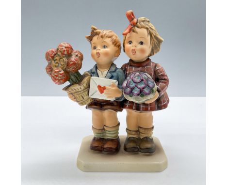 Features a lovely figure of a two children with floral gifts and love letters. Goebel Hummel backstamp. Includes the original
