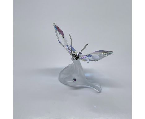 Part of the In The Secret Garden collection. A butterfly with Aurora Boreale crystal wings resting on a frosted crystal leaf.
