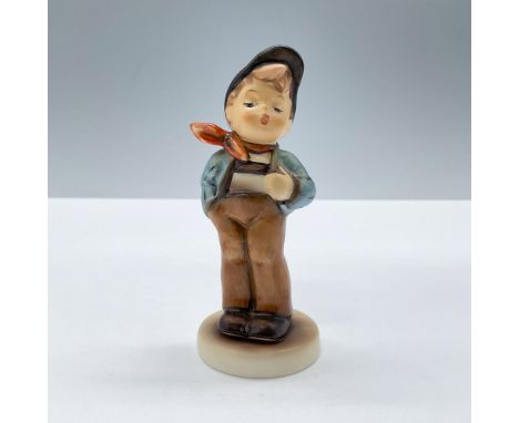 Presenting an adorable boy un blue and brown clothes with red scarf. 'M. I. Hummel' inscribed on base. 1992/1993 exclusive ed