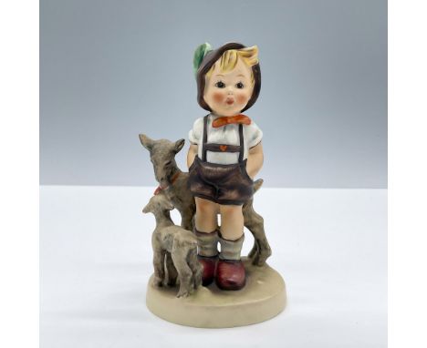 Features a young boy accompanied by his goats. Goebel Hummel backstamp. Issued: 20th centuryDimensions: 2.5''L x 2.5''W x 4.5