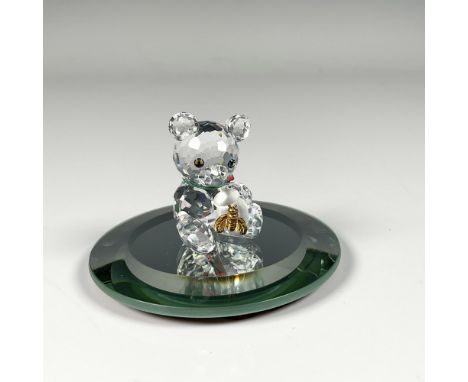 Figure from When We Were Young theme, featuring a bear cherishing its honey pot adorned with an attached golden colored bee f