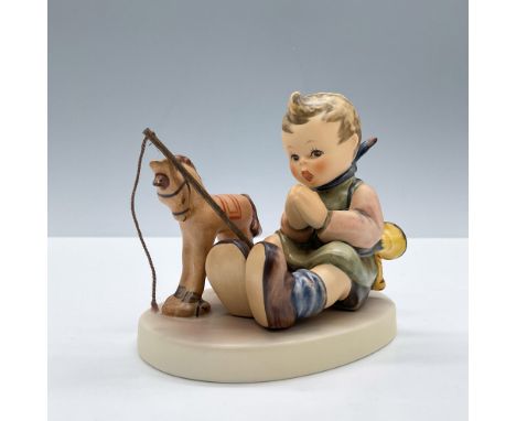 Hand painted in matte finish. Features a child sitting down in prayer by her rocking horse. 1997/1998 M. I. Hummel Club Exclu