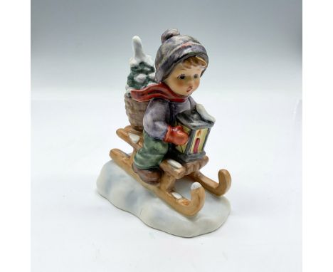 Hand-painted figurine depicting a boy sledding in the snow. Goebel Hummel backstamp. 396. Issued: 20th centuryDimensions: 4"L