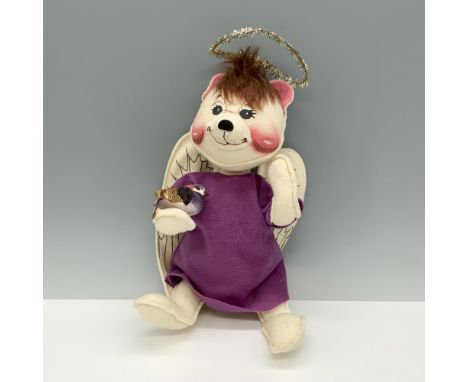 Lovely bear with wings donned in a purple robe while holding a cute little bird. Annalee tag. Issued: 1998Dimensions: 6"L x 5