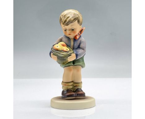 A sweet figure of a boy holding a bag of apples. Exclusive edition 1991/1992 M.I Hummel Club. This item has its original box 