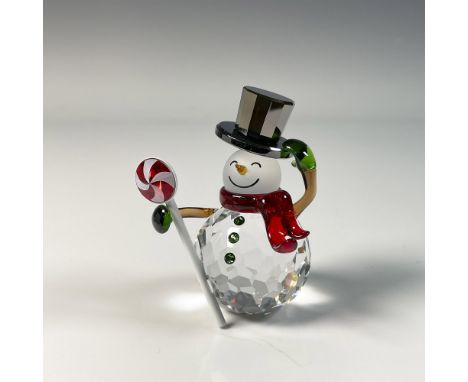 Delightful Christmas snowman figure, crafted from clear crystal with red and green accents. Swarovski swan mark. This item in