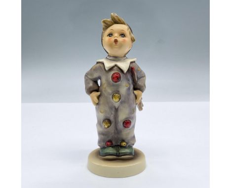 A figure of a boy in a clown suit. Goebel Hummel backstamp. Issued: 20th centuryDimensions: 2.5"L x 2.25"W x 6"HManufacturer: