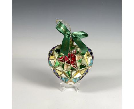 Handcrafted ornament with a stained glass design that forms a beautiful heart, featuring a geometric pattern with vibrant col