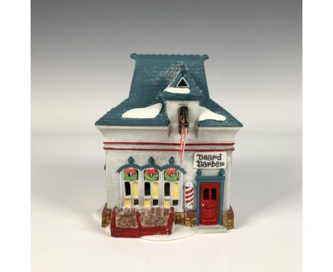 Hand painted porcelain house titled Beard Barber Shop from the Heritage Village Collection. With a snow dusted blue roof, red