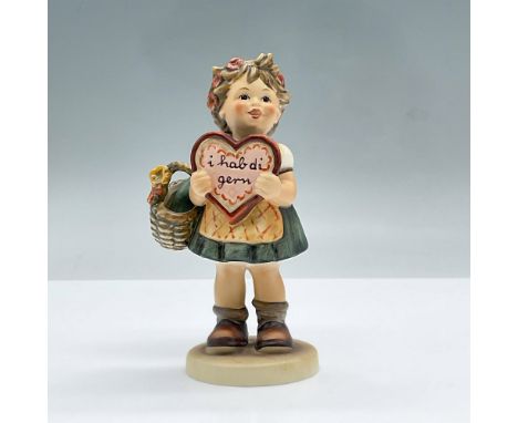 Figure of a little girl with flowers in her hair holding a basket and a heart. Exclusive special edition number 1 for members
