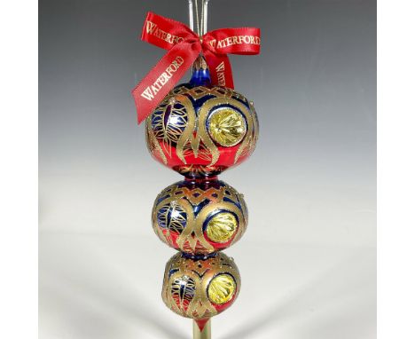 Handcrafted ornament featuring a descending spherical design with vibrant blue, red, and gold accents. Each of the three stac
