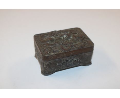 An Oriental cast metal trinket box and cover with dragon decoration AF