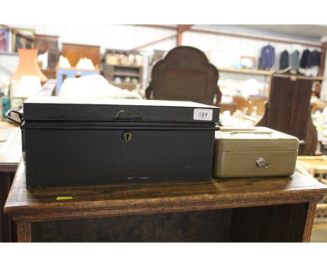 A cash tin and a lock box of various playing cards and tins 