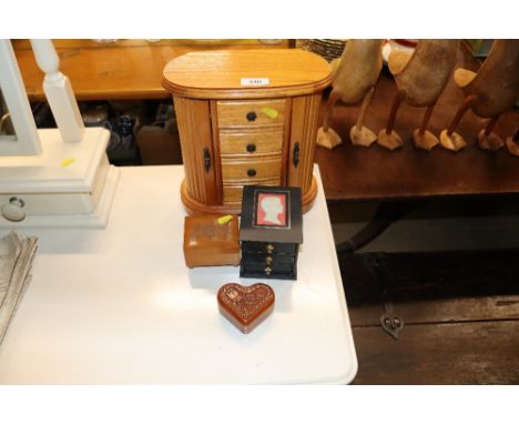 A jewellery chest; together with three other trinket boxes