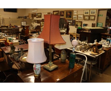 A brass Corinthian column table lamp and shade; and three other table lamps 