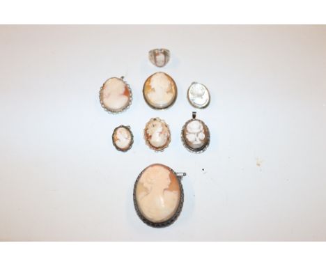 A bag containing various silver and white metal mounted cameo brooches together with a silver cameo ring