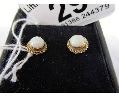 Pair of gold opal stud earrings